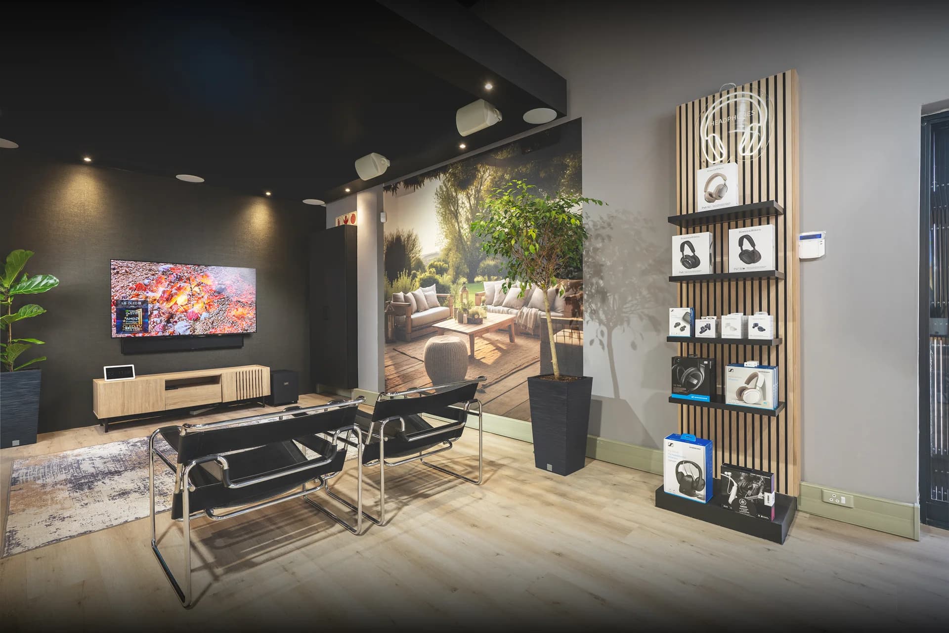 Home theatre wall in the showroom with speakers either side of a large screen