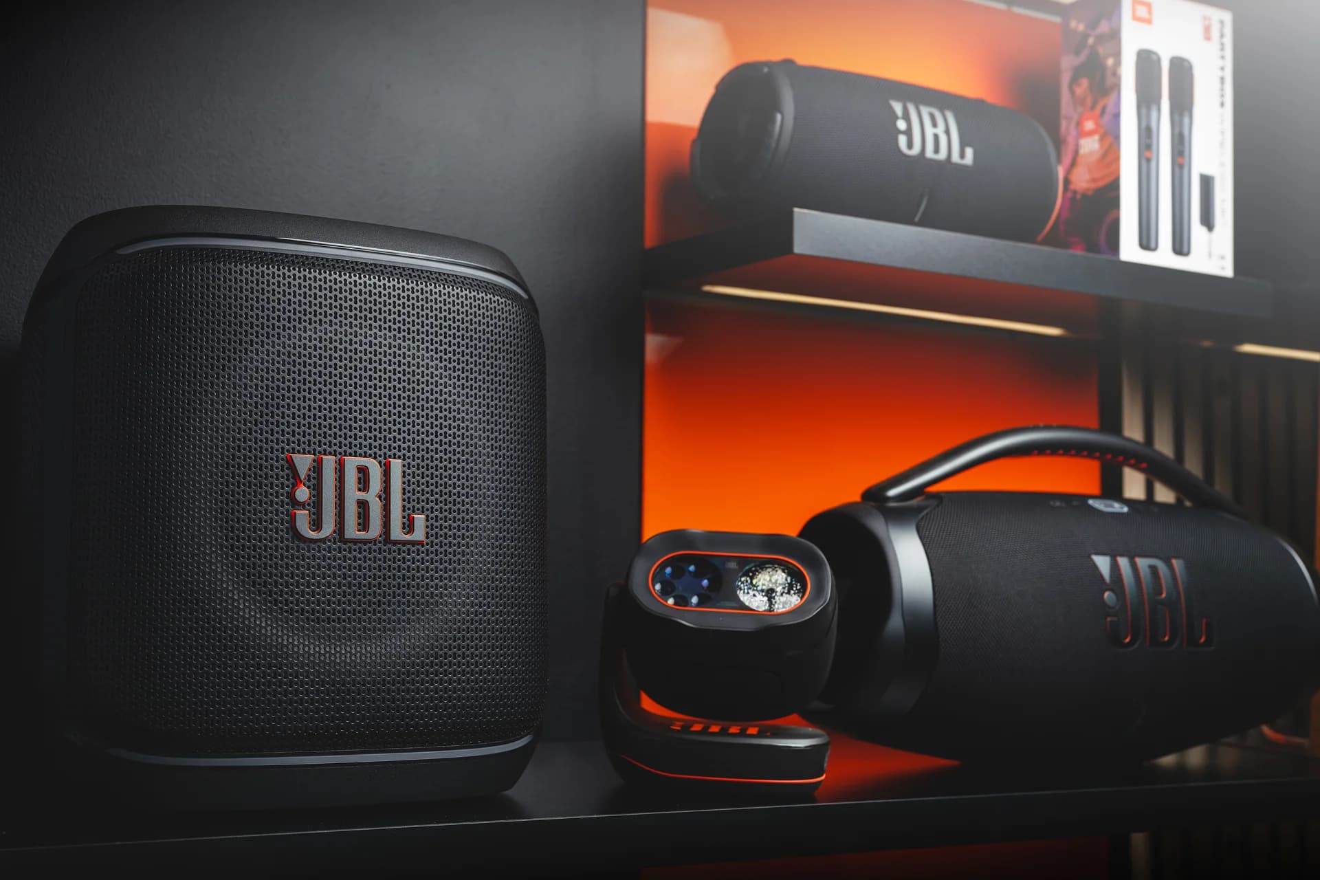 JBL portable speakers on a showroom shelf