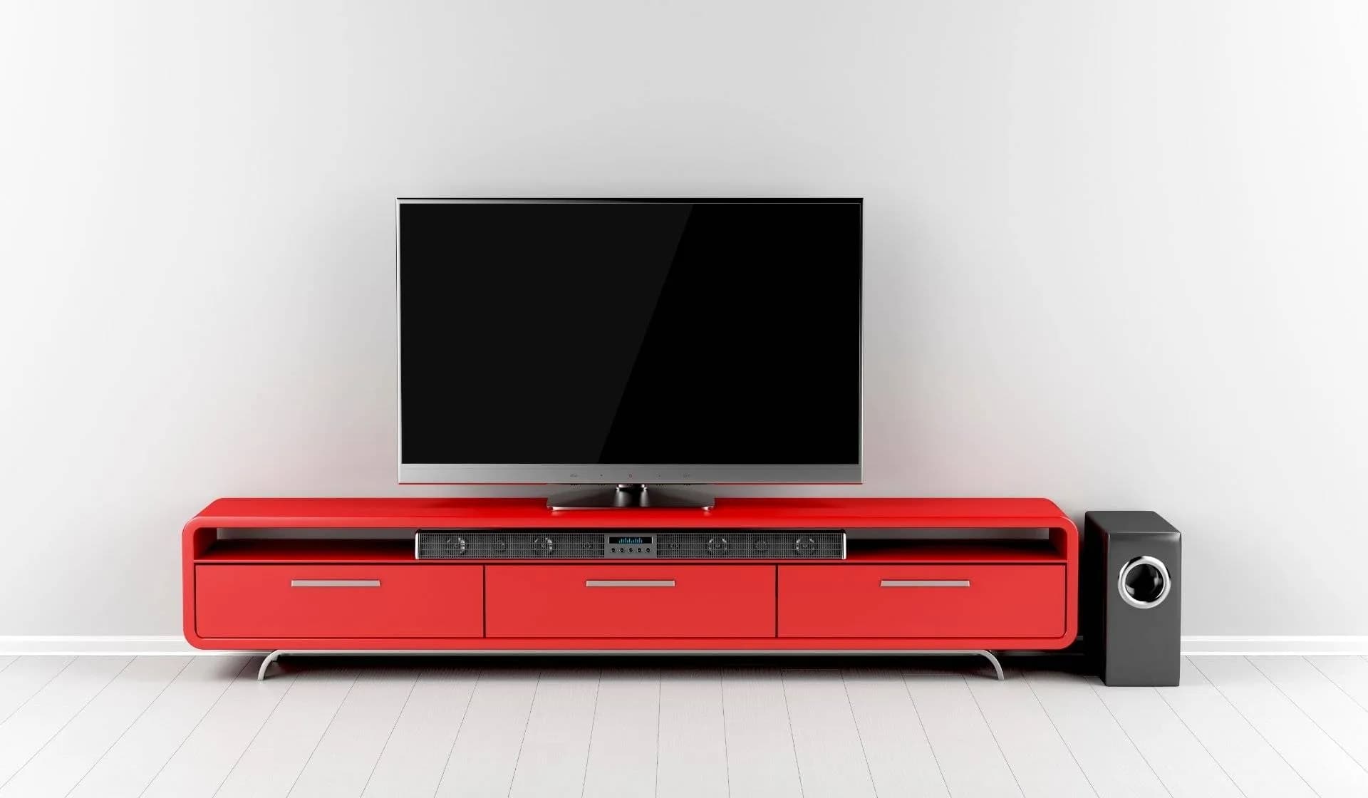 Soundbar and subwoofer beneath a wall-mounted TV